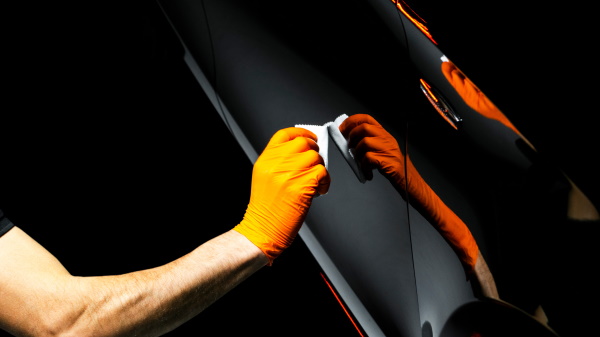 technician applying ceramic coating on car