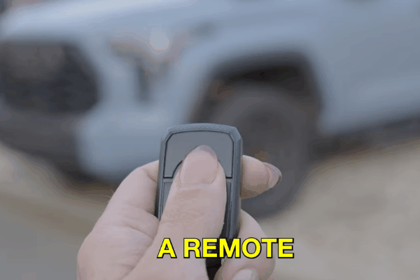 Remote start key fob activating a parked truck with text "TO START"