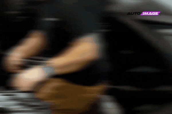 Technician working under the hood of a vehicle during a remote start installation at Auto Image, showcasing professional service and attention to detail in a New Jersey shop.